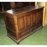 An antique oak mule chest, two drawers to the base.