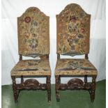 A pair of Victorian 17th-century style high back dining chairs with tapestry seats and backs.