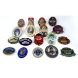 A collection of 18 Beer pump badges