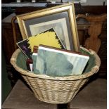 A basket containing prints and paintings