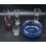 A blue glass vase and four other items