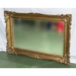 A gilt framed wall mirror