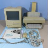 Vintage Apple Macintosh Classic computer and Apple Stylewriter II with mouse, users guide and