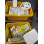 A white Nintendo Wii with various controllers and nineteen Wii games to include Super Mario Galaxy
