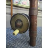 An antique split cane fishing rod with a brass Malloch fishing reel