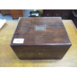 A Victorian rosewood vanity box, fitted interior with red leather compartment tray containing cut