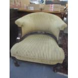 A Victorian mahogany tub chair having fluted front legs