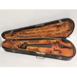 A 20th century Stradivarius model violin, within velvet lined fitted case with bow, no label to