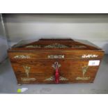 A Regency rosewood and floral mother of pearl inlaid sarcophagus tea caddy, the fitted interior with