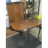 A walnut cabinet above three drawers together with a mid 20th century oak drop leaf table