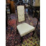 A Victorian rosewood side chair with a carved and fretwork crest, barley twist supports and