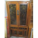 A 20th century Chinese marriage cabinet having chinoiserie panelled doors and drawers, 186 h x 95 w