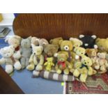 A selection of various teddy bears to include a small Merrythought bear, a sausage dog door stop,
