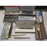 A Mont Blanc ballpoint pen, a Parker fountain pen with a gold nib and other pens