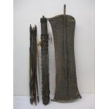 A vintage tribal animal skin shield, 91 h x 31cm w, a leather quiver and arrows (Condition: very