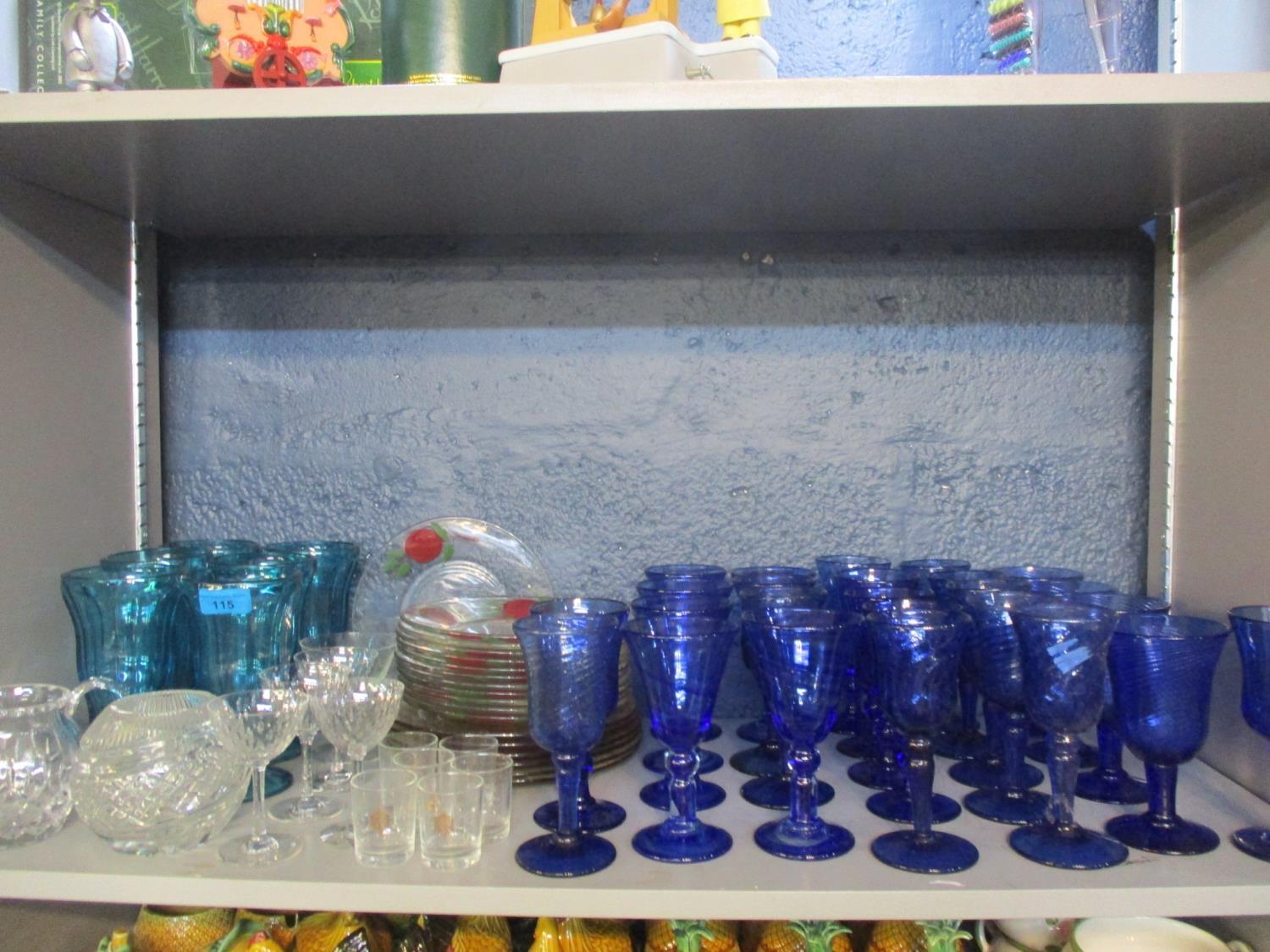 Modern turquoise glass sundae dishes and mixed glassware to include modern cobalt blue wine glasses,