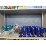 Modern turquoise glass sundae dishes and mixed glassware to include modern cobalt blue wine glasses,
