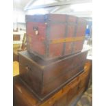 Two trunks to include a Victorian stained pine twin handled trunk and a metal and canvas bound trunk