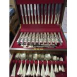 A canteen of silver plated cutlery, twelve setting, to include a carving set. The knives are