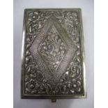 An ornate Indian silver repousse cigarette box stamped 800, 138.85g