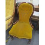 A Victorian mahogany spoon back chair having cabriole front legs and casters