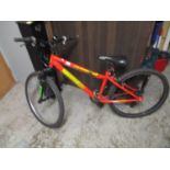 A red coloured Integer bicycle, suitable for child 11-14 years or small adult, in full working order