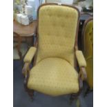 A Victorian walnut button back salon armchair on bulbous front legs