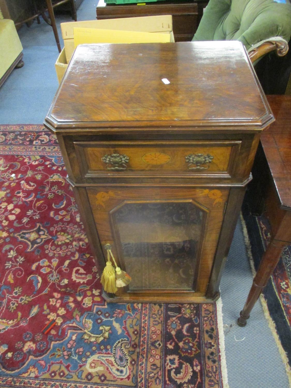 A Victorian walnut and marquetry pier cabinet with a drawer and a glazed door, on later feet 90 h