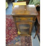 A Victorian walnut and marquetry pier cabinet with a drawer and a glazed door, on later feet 90 h