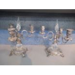 A pair of silver plate and engraved glass three branch table candelabra's 27cm h