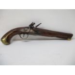 An early 19th century Joiner Flintlock pistol with floral engraving to the tail of the lock plate, a