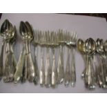 A quantity of silver cake forks and spoons, possibly French, monogrammed H.M to the handle,