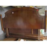 A reproduction yew fielded panelled wardrobe and double head board