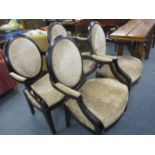 Four modern armchairs having mahogany stained frames and brown velvet upholstery