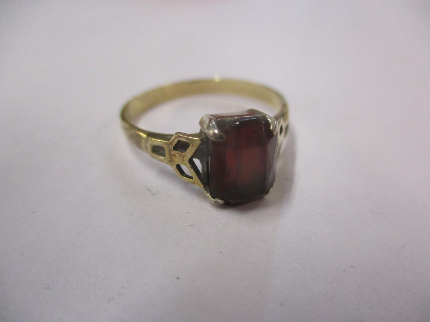 A 9ct gold and silver set garnet dress ring, weight 2.4g in total, ring size UK letter R