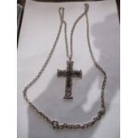 A large white metal and black stone crucifix pendant with link stamped 925 together with a heavy