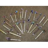 A quantity of vintage bobbins to include ivory and treen examples with bead detail