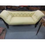 A Victorian stained mahogany salon sofa with scrolled ends having a cream upholstery 92 x 200cm