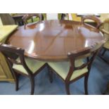 A Victorian mahogany tilt top breakfast table on central pedestal together with four mahogany dining