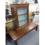 A modern low hardwood coffee table on block legs 33 x 130 x 66cm together with an early 20th century