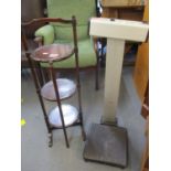 A mahogany folding three tier cake stand together with a Seca floor standing scales