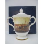 A Royal Doulton china lidded cup to commemorate the 100th Championship Season of the Football