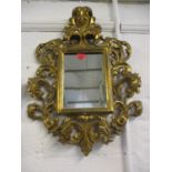 An ornate gilt wood wall mirror 60 x 44cm