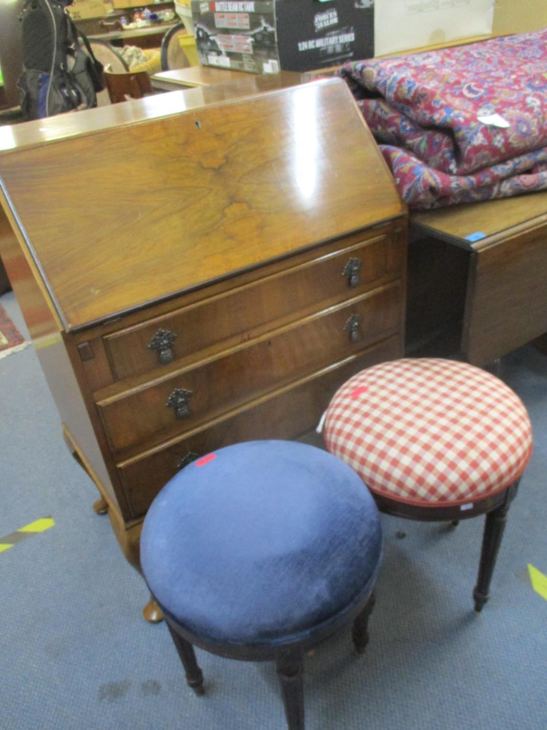 A mid 20th century walnut bureau on cabriole legs