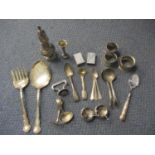 A group of silver items to include teaspoons and napkin rings and a small quantity of silver plate