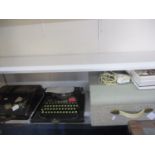 A Corona typewriter and a vintage New Yorker tape to tape recorder, together with a quantity of