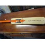 A modern West Indies signed cricket bat with the logo 'Woodworm, The Flame' with Freddie Flintoff'