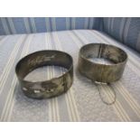 Two early 20th century silver bangles, one stamped Sterling, 94.8g