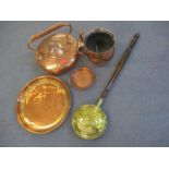 A large dove tailed copper tea kettle and three other items of copper together with a brass