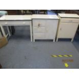 A mid 20th century white enamelled and painted side table and two matched units